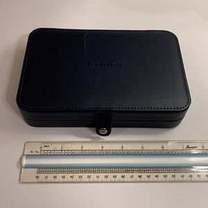 Gently used black Landici travel jewelry box with small scratch on top (photo).